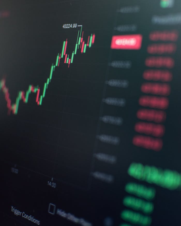 services-04 Close-up of a fluctuating cryptocurrency market chart showing stock prices on a digital screen.